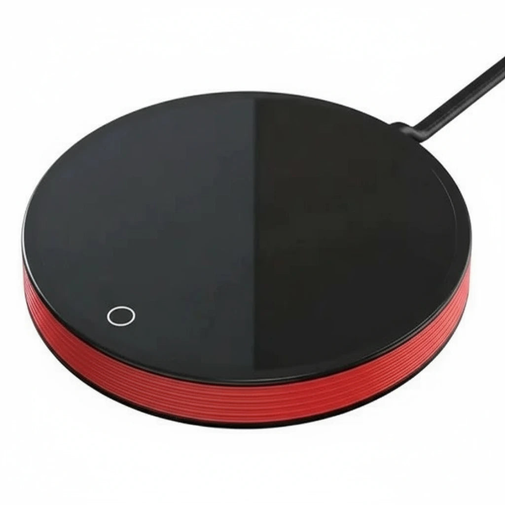 Round black and red heating pad on a white background